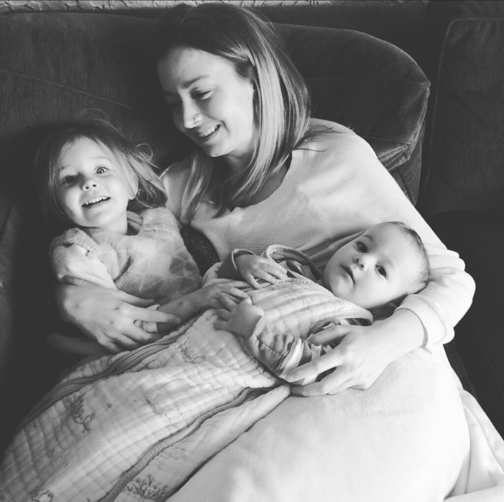 Me and my two girls snuggling on the couch. I was in a deep postpartum depression.